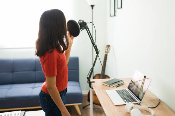 Lady getting online singing lessons in Huddersfield