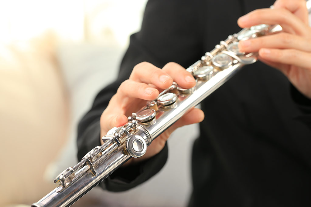 Male student being taught lessons by flute teacher in holmfirth