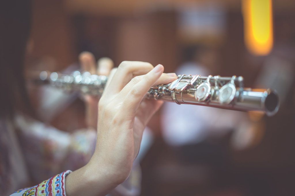 Flute Teacher in Bradford giving a lady flute instruction