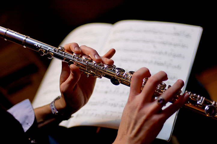 Person receiving online flute lessons in Halifax using metal flute