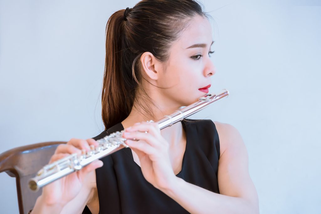 Lady practicing her online flute lessons in bradford