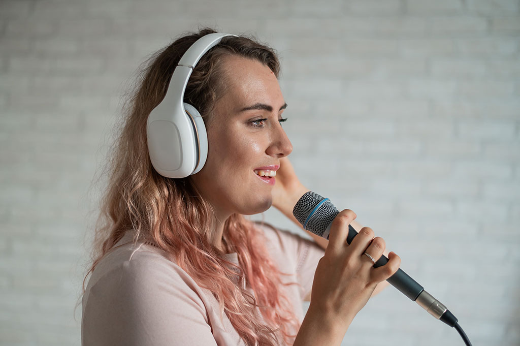 Lady receiving online singing lessons in holmfirth