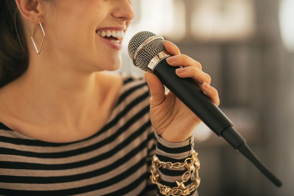 young lady practicing singing lessons in Leeds