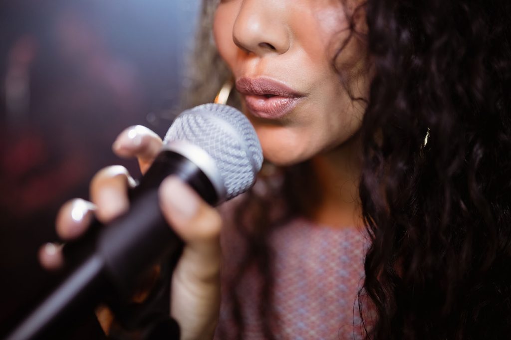 Close up of female singer doing singing lessons in Bradford