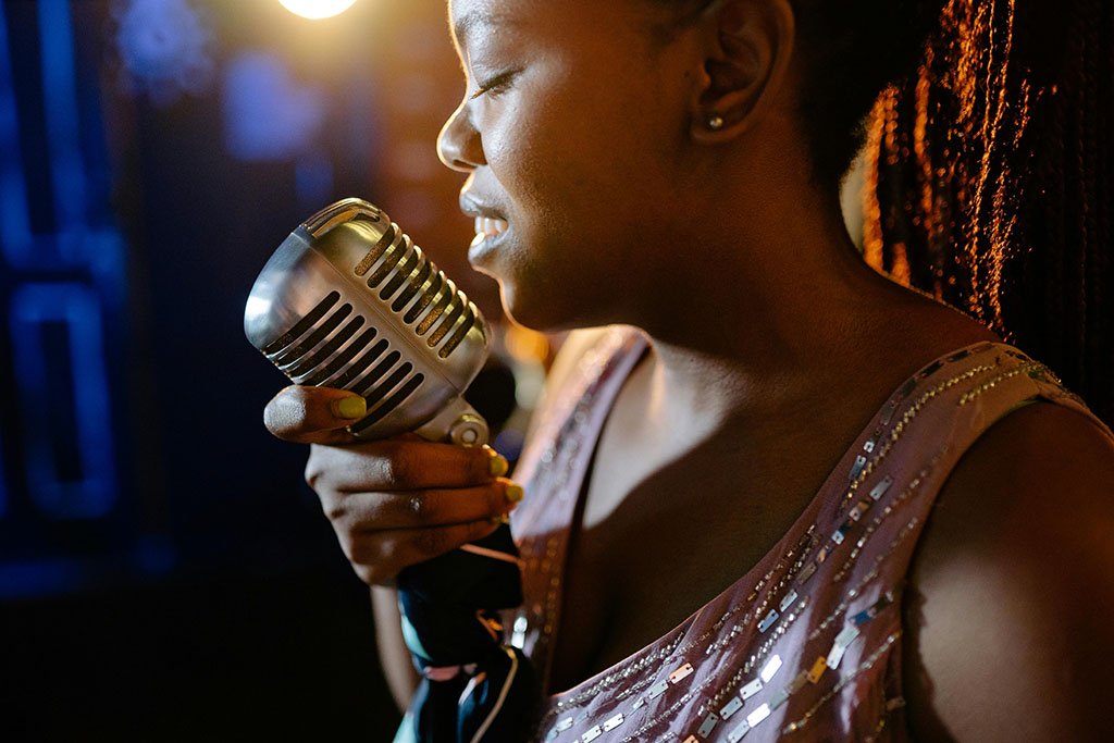 Coloured lady receiving singing lessons in Barnsley